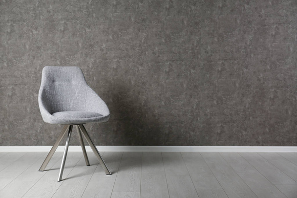 Grey modern chair for interior design on wooden floor at gray wall - Φωτογραφία, εικόνα