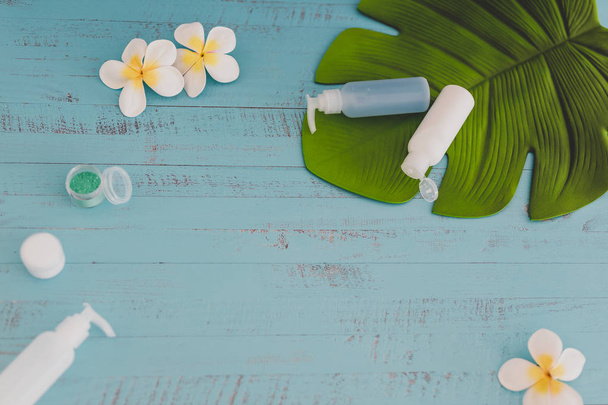 organic lotions and skincare products with tropical flowers and  - 写真・画像
