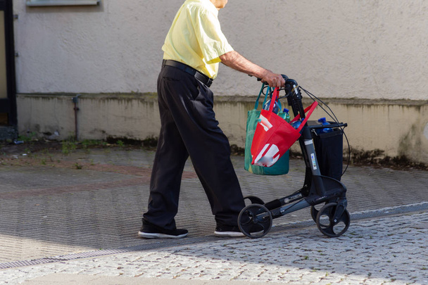 man with rollator shopping - Fotoğraf, Görsel