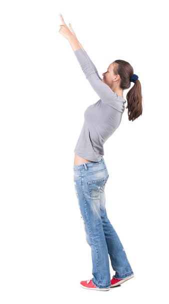 Back view of pointing woman. - Zdjęcie, obraz
