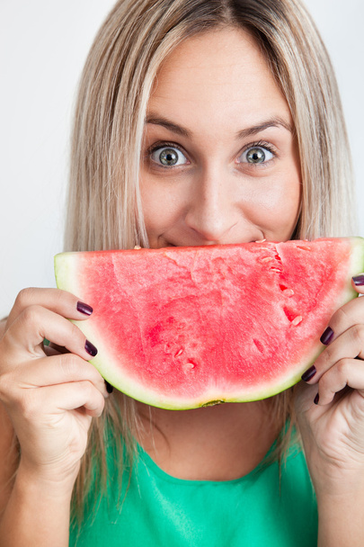 Portrait of a young woman smiling with water melon - Photo, image