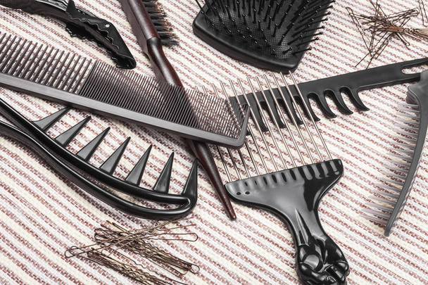 set of different hairbrushes, bobby pins and hair sticks - Foto, Imagen