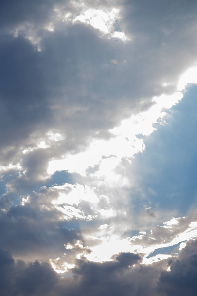 blue sky with clouds backlit by the soft rays of the sun. Natural background. - Photo, image