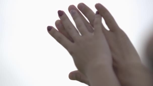 Close up of male and female hands with the sky in the background. Man and woman raising hands. Romantic relationship - Materiał filmowy, wideo