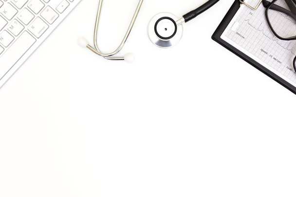 Stethoscope, Top view of doctor's desk table, blank paper on white background,  - Fotografie, Obrázek
