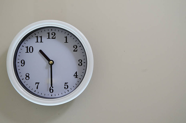 The time of the wall clock hanging clock is 10: 30
                                - Фото, изображение