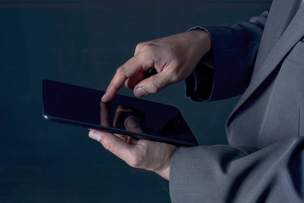 Businessman working on a digital tablet - Фото, зображення