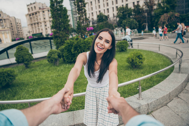 Portrait of positive cheerful excited people millennial spouses have honeymoon free time laugh laughter enjoy content white trendy stylish dress romance romantic skirt mood town outside stroll - Фото, зображення