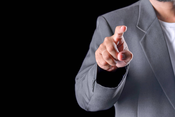 Business man with pointing to something or touching a touch screen - Photo, Image