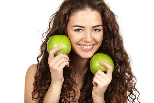 Beautiful brunette holding apples - Valokuva, kuva