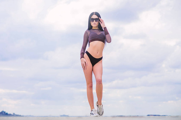 training. perfect body with no cellulite and fat. freedom. sensual girl in underwear and sunglasses outdoor. sport and fitness. Sky. sexy woman with fit body. summer fashion beauty. training time - 写真・画像