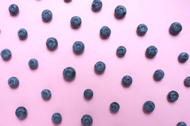 Blueberries pattern on pink background top view - Fotoğraf, Görsel