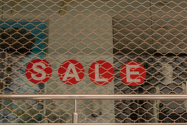 Window display with red sale board inside the shop at Bengaluru, India - Photo, Image