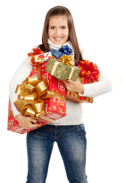 Young brunette girl holding gifts - Photo, image