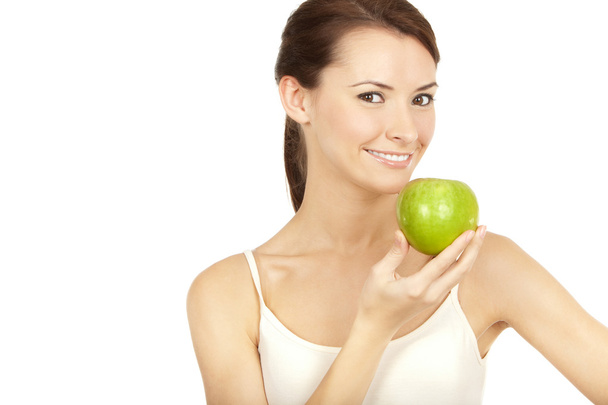 Beautiful brunette holding apple - Photo, image