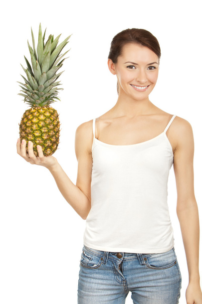 Beautiful brunette holding pineappl - Фото, изображение
