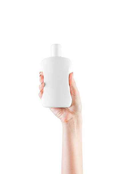 Botella de crema de mano femenina de loción aislada. Chica dar productos cosméticos sobre fondo blanco
 - Foto, Imagen