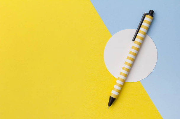 Pen at yellow turquoise creative background with copy space.  - Photo, Image