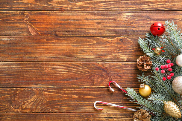 Christmas tree branch and decor on wooden background - Zdjęcie, obraz