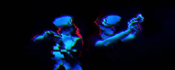 Couple with virtual reality headset are playing game. Image with glitch effect. - Фото, зображення