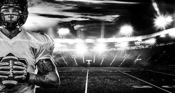 American football player, sportsman in helmet on stadium. Black and white photo. Sport wallpaper. - Foto, immagini