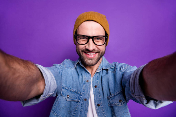 Photo of cool guy online video translation own blog wearing specs casual denim outfit isolated violet background - Fotoğraf, Görsel