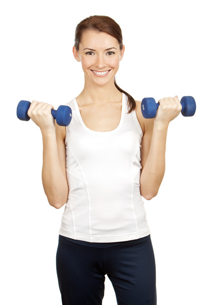 Young brunette woman with dumbells - Foto, imagen