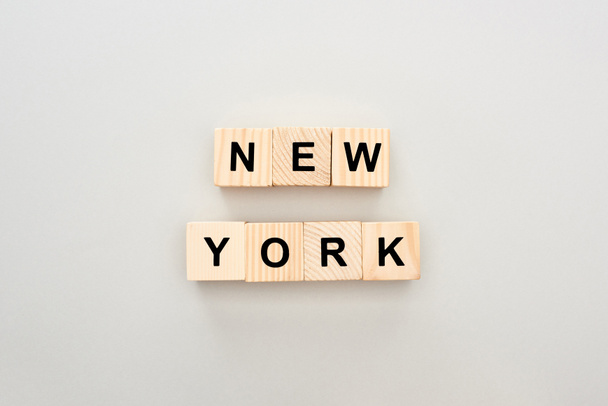 top view of wooden blocks with New York lettering on white background - Foto, imagen