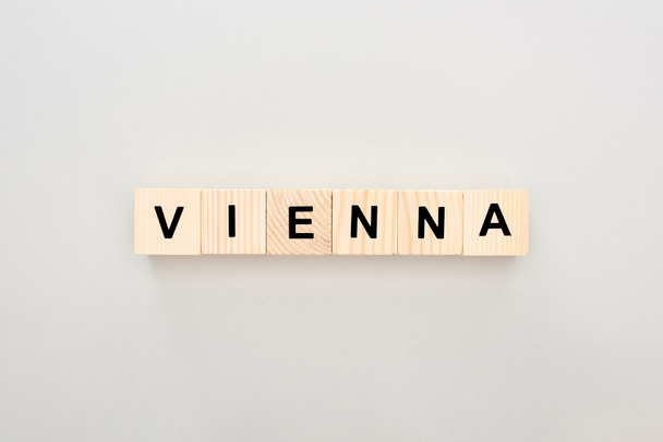 top view of wooden blocks with Vienna lettering on white background - Photo, Image