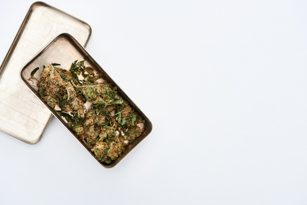 top view of Marijuana Buds in metal case on white background - Valokuva, kuva
