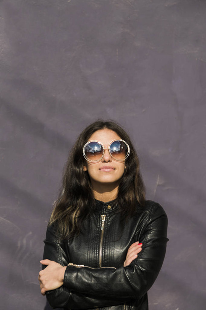 portrait of young latin american woman with big round sunglasses - Photo, Image