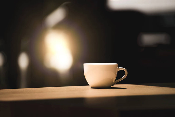 Cup of aromatic coffee on wooden table  - 写真・画像