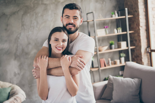 Portrait of two nice attractive lovely stylish cheerful cheery positive gentle confident people sending free time at industrial loft interior style room house apartment - Fotografie, Obrázek