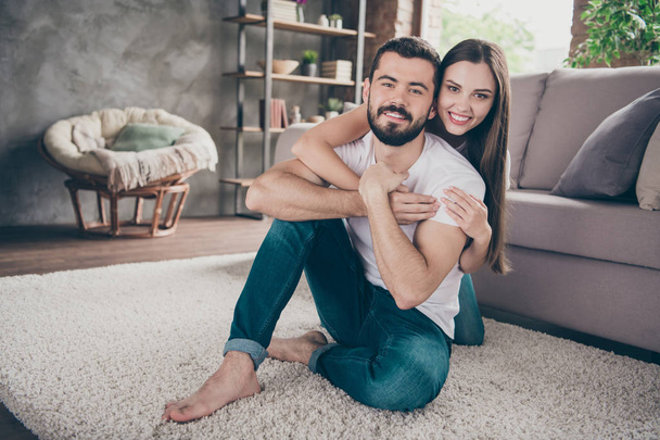 Portrait of his he her she two nice attractive lovely stylish cheerful cheery positive tender people having fun day daydream honeymoon sitting on floor at home house apartment indoors - Photo, image