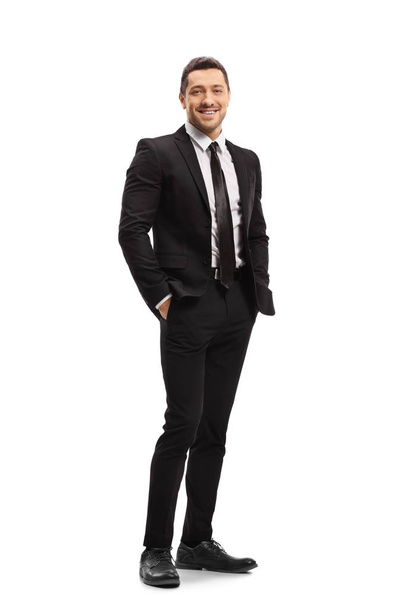 Young man wearing a modern black suit and smiling - Foto, immagini