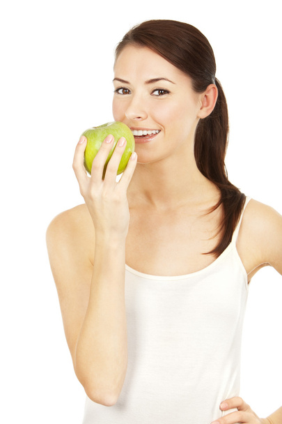 Beautiful brunette holding apple - Fotó, kép