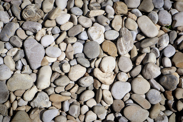 nature background : pebbles texture, rounded stone smoothed by river water - Photo, Image