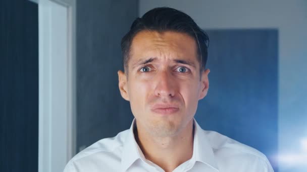 Portrait of shocked man doing facepalm. Unpleasantly surprised businessman. Concept of disappointment, shame and embarrassment. - Footage, Video