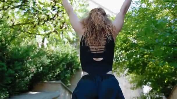 Woman doing bearhing exercise outdoors - Кадри, відео