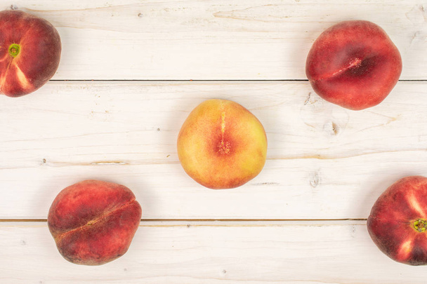 Fresh paraguay peach on grey wood - Foto, Imagen