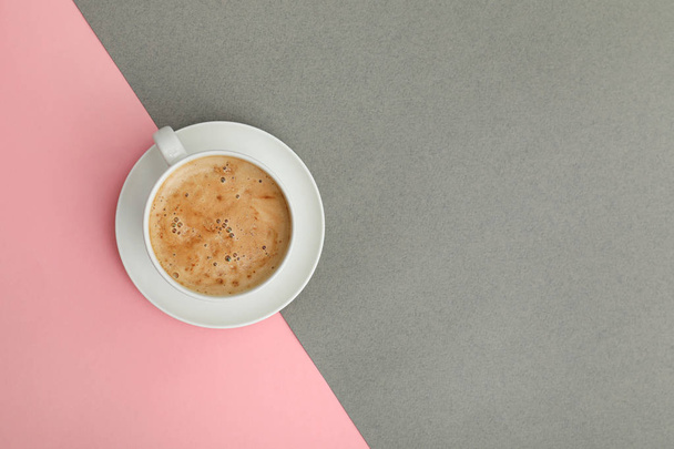 Cup of coffee on color background, top view. Space for text - Zdjęcie, obraz