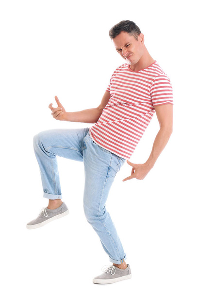 Happy attractive man dancing on white background - Photo, Image