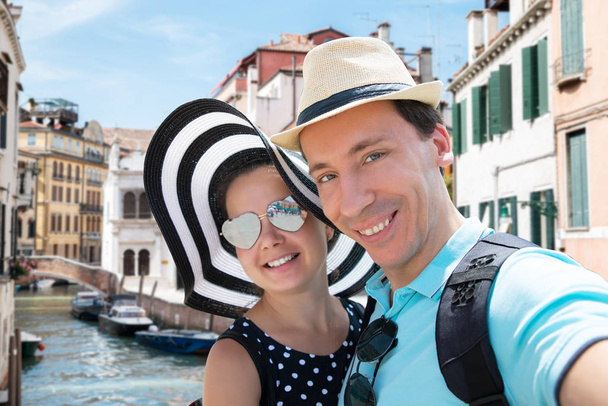 Portrait Of Smiling Loving Couple Taking Selfie On Venice Street - Фото, зображення