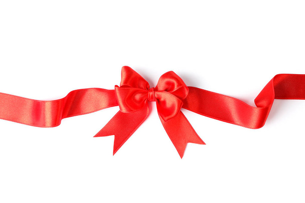 Red ribbon with bow isolated on white background. Gift concept - Photo, Image