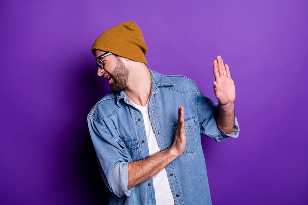 Portrait of his he nice attractive displeased bearded guy avoiding unpleasant news attack conflict fight isolated over bright vivid shine violet lilac background - Foto, afbeelding