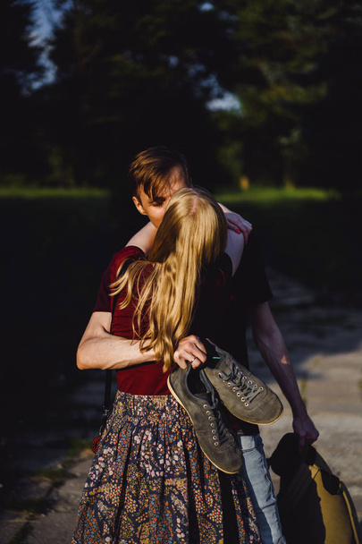 young couple in love, walks, hugs, kisses, happy couple of teenagers. - Valokuva, kuva