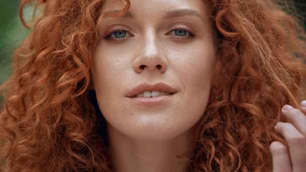 close up of happy redhead girl touching hair  - Záběry, video