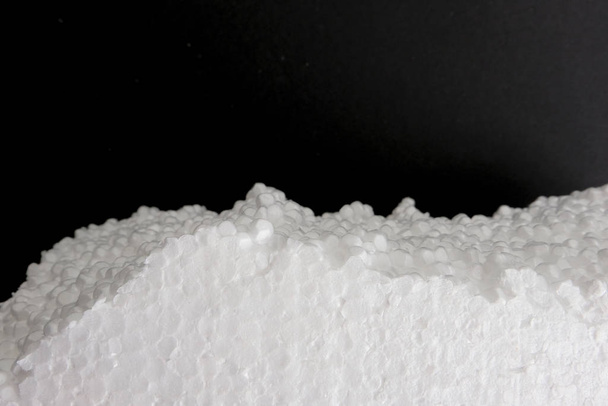 Styrofoam clouseup on darck background. Foam plastic texture. - Photo, Image