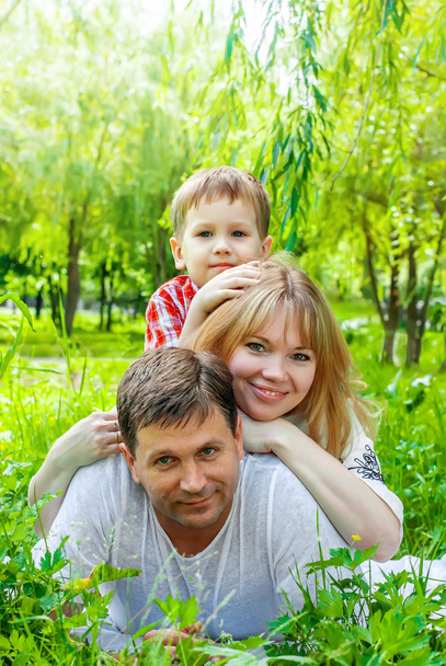Happy Smiling Family in a park - Foto, imagen