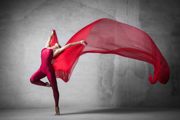 ballet dancer in the work, the dancer with a cloth, a girl with a beautiful body, elegantly girl, graceful woman, athletic body, time show, the girl in flight, red silk in air, girl, flying, jumping, jumpsuit, air, light, love, dancer, posing, - Photo, Image